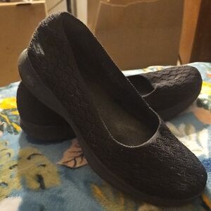 Skechers Black Flats with Elegant Slip-On Design